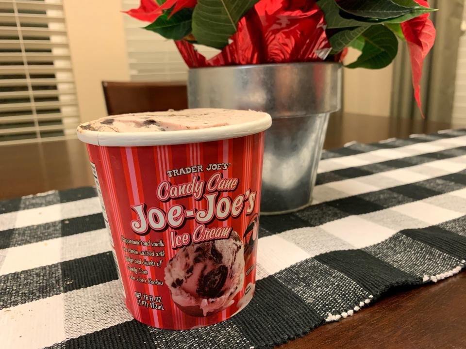 tub of trader joes candy cane joe joes ice cream on kitchen table