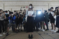 Hong Kong activist Agnes Chow arrives at a court in Hong Kong, Monday, Nov. 22. 2020. Hong Kong pro-democracy activists Joshua Wong, Agnes Chow and Ivan Lam appear at court for their trial, as the trio faces charges related to the besieging of a police station during anti-government protests last year. (AP Photo/Vincent Yu)