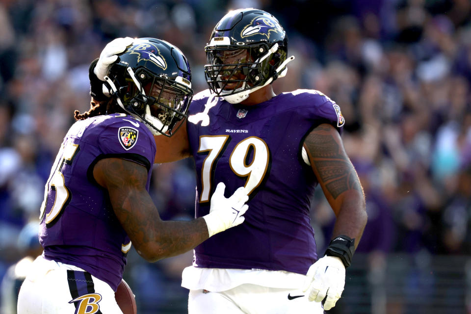 BALTIMORE, MARYLAND – NOVEMBER 05: Gus Edwards #35 of the Baltimore Ravens celebrates a touchdown with Ronnie Stanley #79 during the second quarter in the game against the Seattle Seahawks at M&T Bank Stadium on November 05, 2023 in Baltimore, Maryland. (Photo by Patrick Smith/Getty Images)