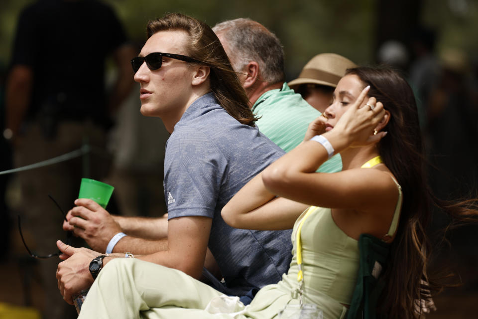 Clemson's Trevor Lawrence, pictured with his now wife Marissa Mowry at the Masters on April 8, was fairly candid in an interview with Sports Illustrated. (Photo by Jared C. Tilton/Getty Images)