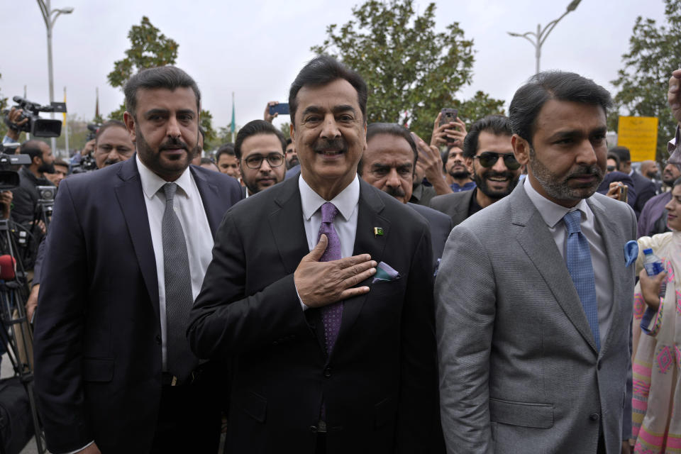 Pakistan's newly elected lawmaker Yusuf Raza Gilani, center, arrives to attend opening session of the Parliament, in Islamabad, Pakistan, Thursday, Feb. 29, 2024. Pakistan's National Assembly swore in newly elected members on Thursday in a chaotic scene, as allies of jailed former Premier Khan protested what they claim was a rigged election. (AP Photo/Anjum Naveed)