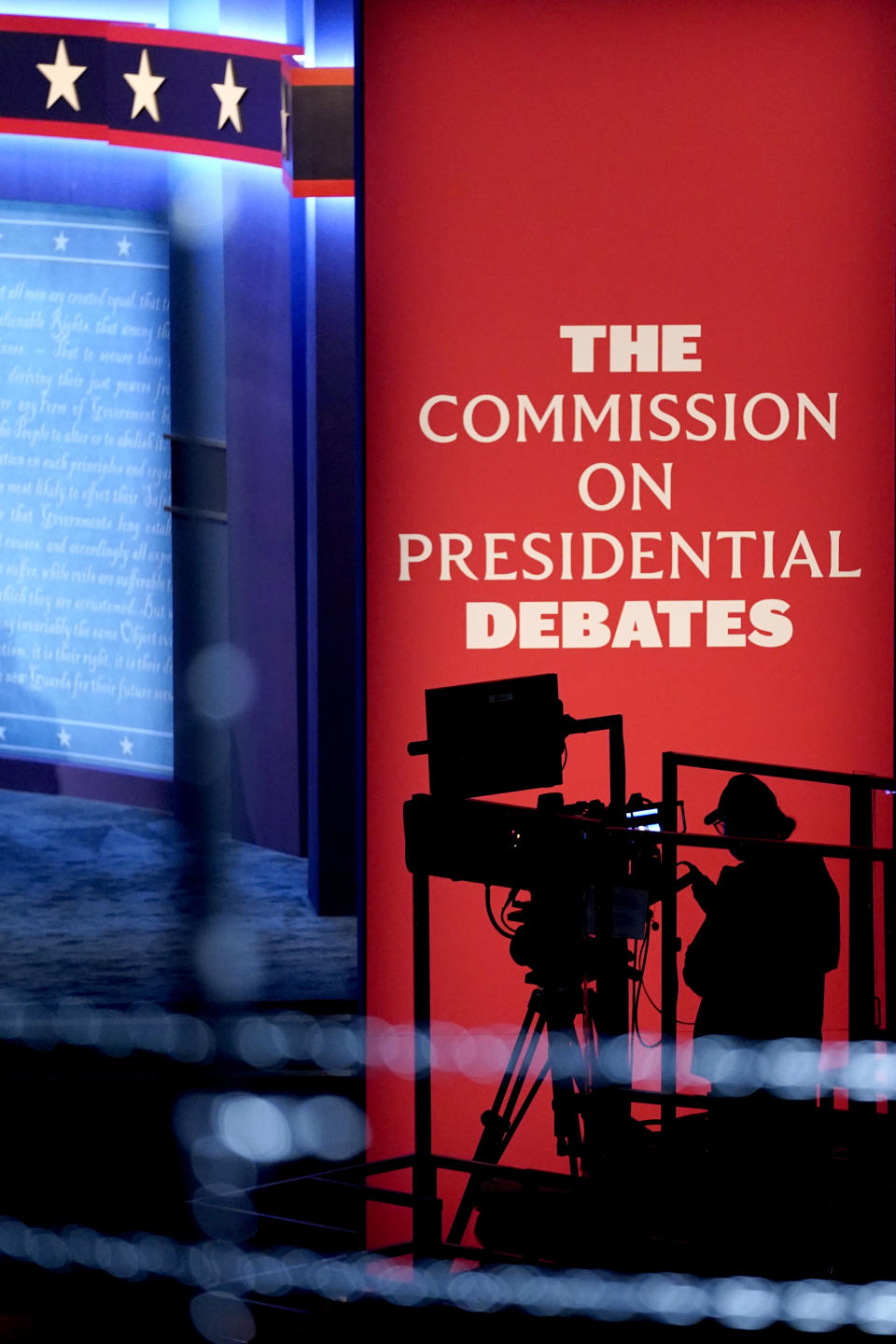 A camera operator is seen near his rig during a rehearsal tests ahead of the final presidential debate between Republican candidate President Donald Trump and Democratic candidate former Vice President Joe Biden, Wednesday, Oct. 21, 2020, in Nashville, Tenn. The debate will take place Thursday, Oct. 22 at the Curb Event Center at Belmont University. (AP Photo/Julio Cortez)