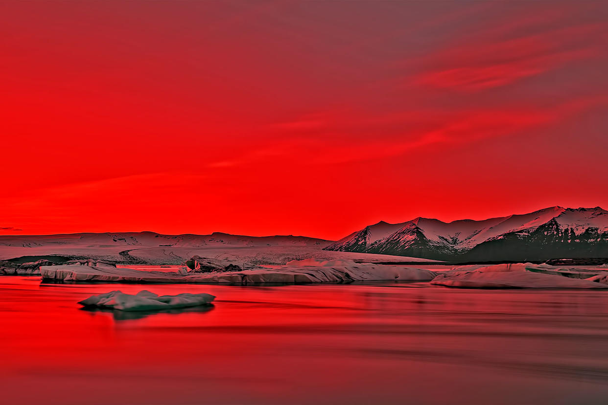 Vibrant Red Sunset Over Icebergs in Jokulsarlon Glacier Lagoon, IceGetty Images/Dhwee