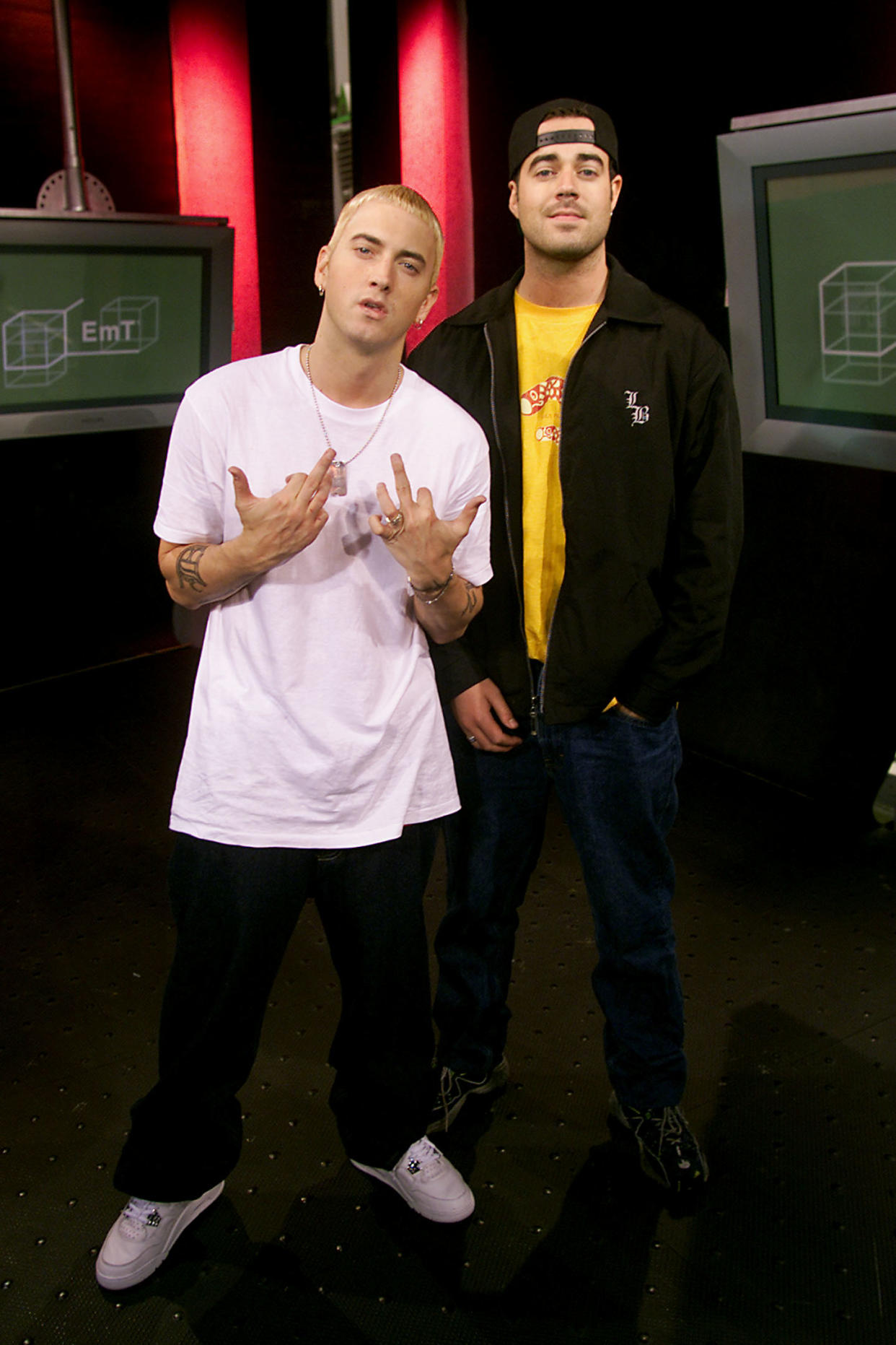 Eminem poses for a photo with Carson Daly on set of TRL at the MTV Studios in New York City on May 10, 2000.  Photo by Scott Gries/Getty Images