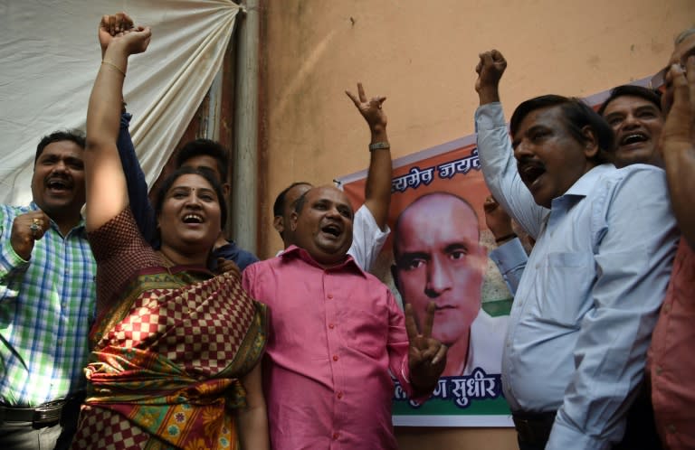 Friends of Indian national Kulbhushan Jadhav celebrate in Mumbai on May 18, 2017 after he is given a stay of execution in a high-profile case at the International Court of Justice