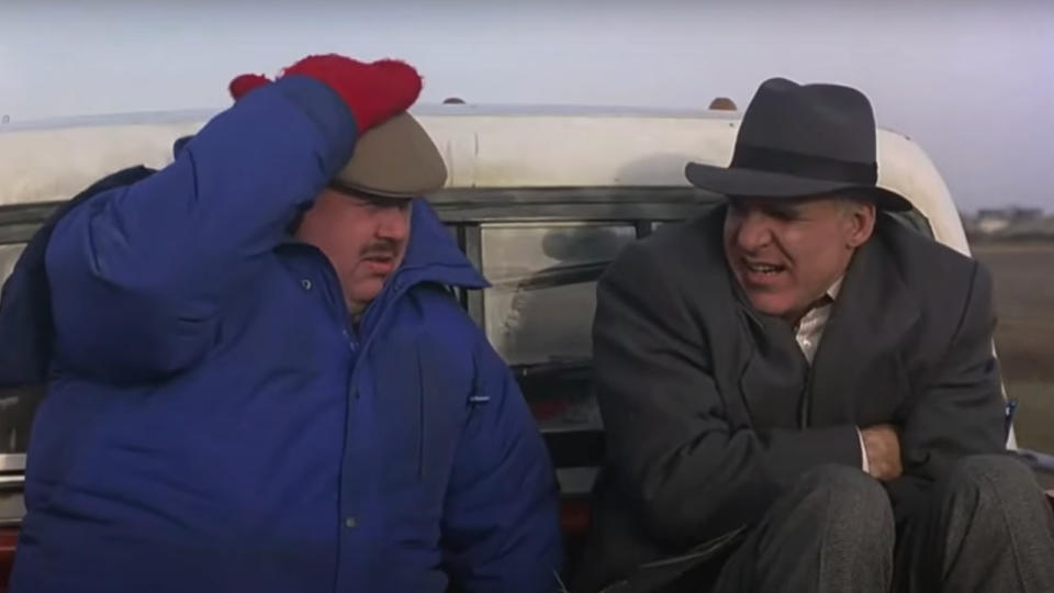 John Candy and Steve Martin freezing in a truck bed in Planes, Trains, and Automobiles.