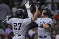 New York Yankees' Giancarlo Stanton (27) celebrates with Aaron Judge after hitting a two-run home run against the Houston Astros during the third inning of a baseball game Friday, Sept. 1, 2023, in Houston. (AP Photo/Kevin M. Cox)