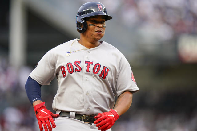 Boston Red Sox 3B Rafael Devers hangs his head after flying out