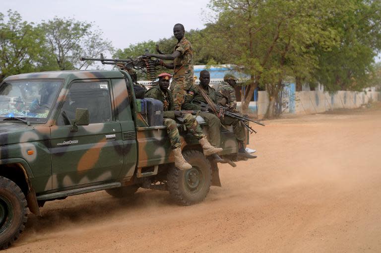 South Sudan's former rebel army patrol, in Malakal, the capital of the biggest oil producing state Upper Nile, on January 12, 2014