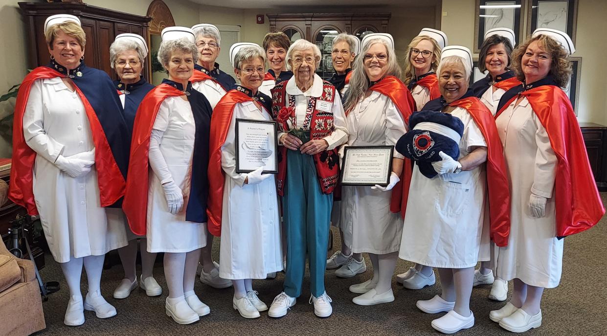 The Nurse Honor Guard honored 100-year-old Army nurse Dorothy Managan recently in Brevard. Pictured from left to right are, front rowt: Doris Silvernell, Co-Founder, Marie Oakes, Jean Poteat, Honoree Dorothy Managan, Donna Miller, Cecilia Neira, and Cynthia Glover-Hoxit, Founder; back row: Joyce Williams, Judy Keels, Cindy Crawford, Barb McElroy, Samantha Burleson, and Barbara Moore.