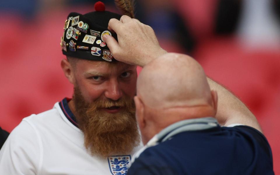 Scotland fan gives his hat to an Englishman -  Pool via REUTERS/Carl Recine