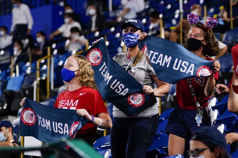 Fans of team United States cheer during a softball game against Japan at the 2020 Summer Olympics, Tuesday, July 27, 2021, in Yokohama, Japan. (AP Photo/Matt Slocum)