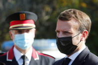 French President Emmanuel Macron arrives at the 'Centre de cooperation policiere et douaniere' (Franco-Spanish Police and Customs Cooperation Center) during a visit on the strengthening border controls at the crossing between Spain and France, at Le Perthus, France, Thursday, Nov. 5, 2020. (Guillaume Horcajuelo, Pool via AP)