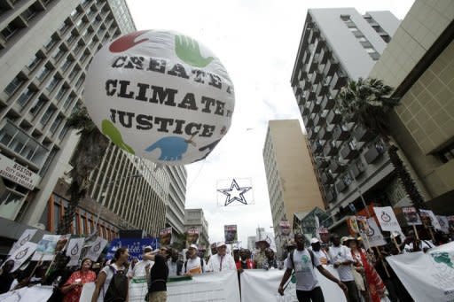 Environmentalists demand for action to combat global warming during a protest in Durban on December 3. UN climate talks on Monday enter their second week entangled in a thick mesh of issues with no guarantee that negotiators and their ministers will be able to sort them out