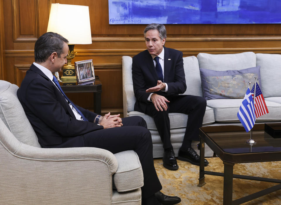 Secretary of State Antony Blinken, right, speaks with Greece's Prime Minister Kyriakos Mitsotakis during their meeting at Maximos Mansion in Athens, Greece, on Monday, Feb. 20, 2023. Blinken will be on a two-day trip in Athens, after his visit to Turkey, to meet with the country's leadership and launch the fourth round of the US-Greece Strategic Dialogue. (Louiza Vradi/Pool Photo via AP)