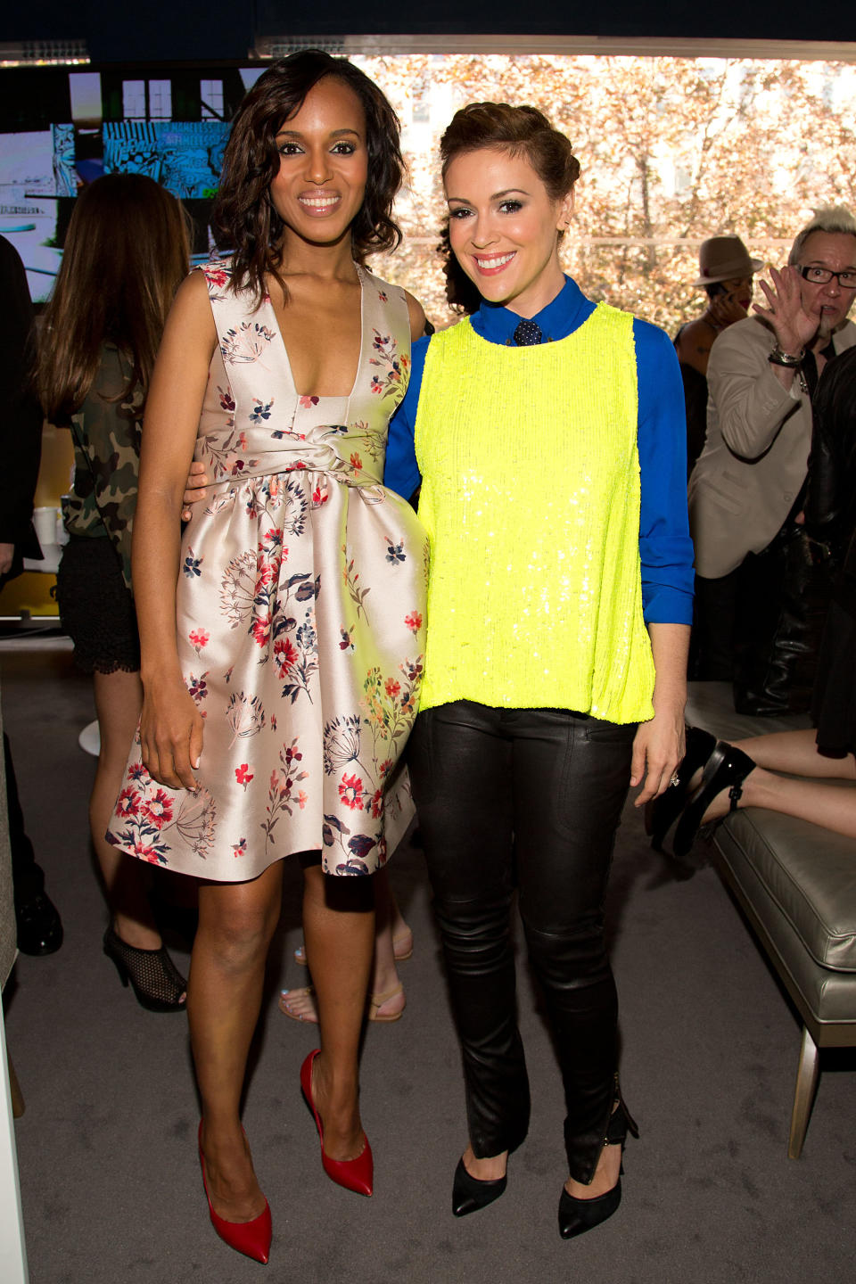 Actors Kerry Washington, left, and Alyssa Milano attend the "Project Runway" fashion show on Friday, Sept. 6, 2012, during Fashion Week in New York. (Photo by Dario Cantatore/Invision/AP)