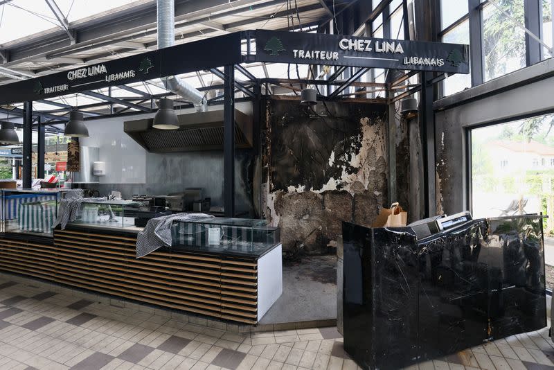 A view of the damaged interior of the indoor market in L'Hay-les-Roses