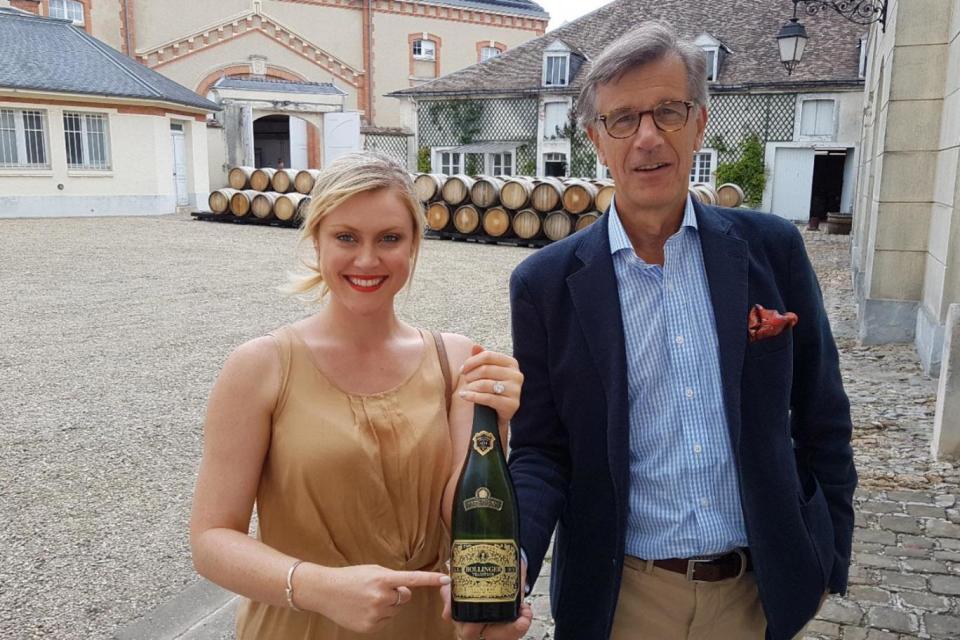 Camilla and Guy De Rivoire holding the wine Charles and Diana sipped at their wedding