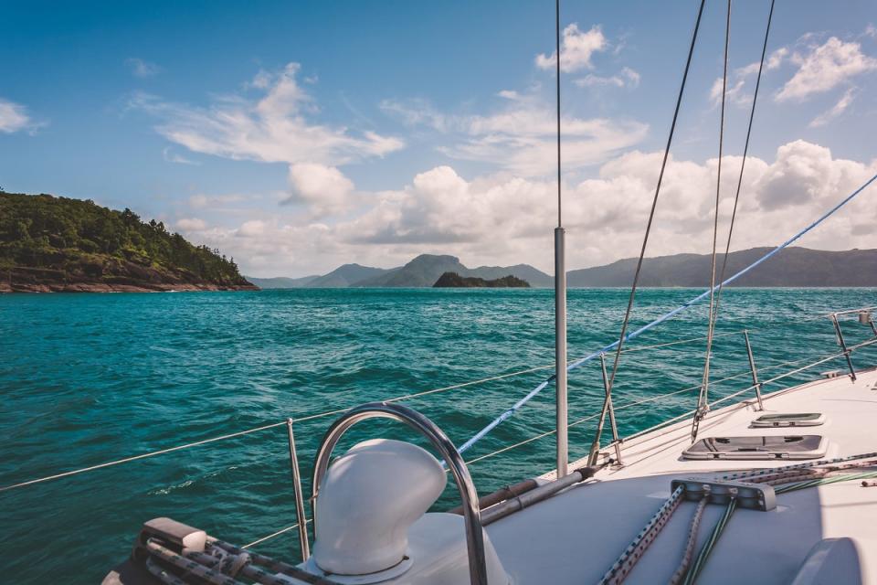 Set sail to the white sands of the Whitsundays for a snorkel with the lively marine life (Getty Images/iStockphoto)
