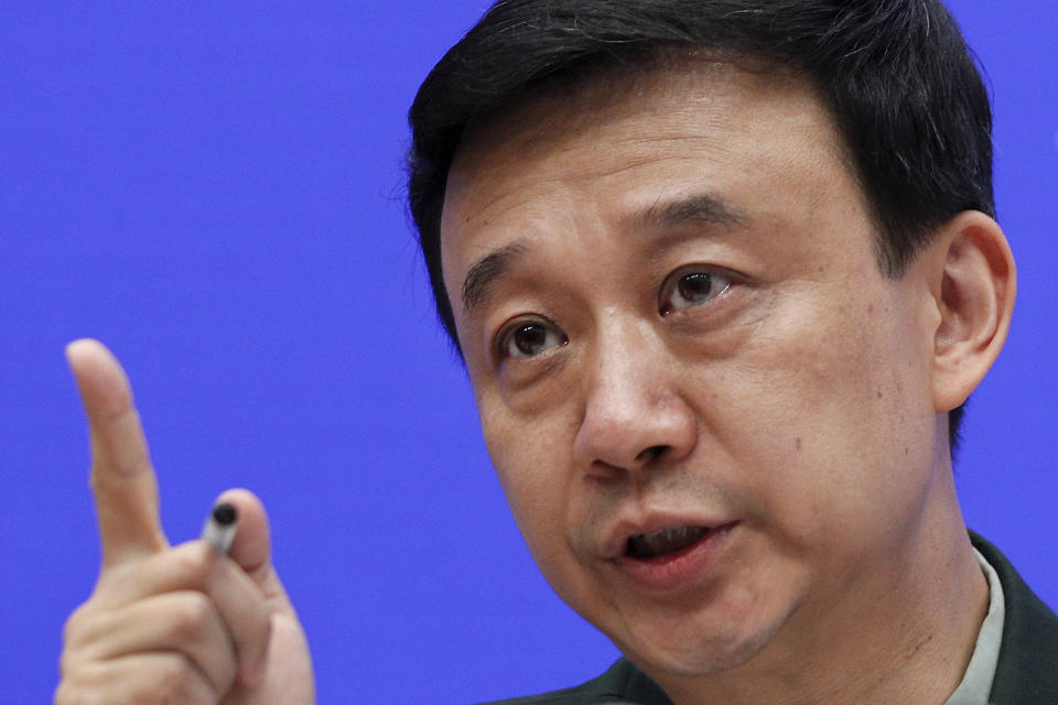 Defense Ministry spokesman Wu Qian gestures as he speaks during a press conference at the State Council Information Office in Beijing, Wednesday, July 24, 2019. China says it will not "renounce the use of force" in efforts to reunify Taiwan with the mainland and vows to take all necessary military measures to defeat "separatists." (AP Photo/Andy Wong)