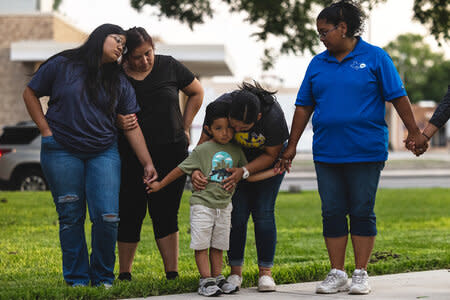 Members of the community gather at the City of Uvalde Town Square for a prayer vigil