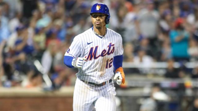 New York Mets infielder Francisco Lindor throws during spring