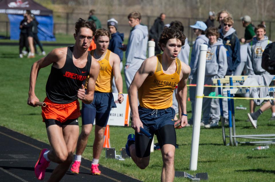 Jonesville's Gavin Van Kampen races against Hornet Dominick Coke in the 4x400. Hillsdale would pull away in the final 100 meters for the win.