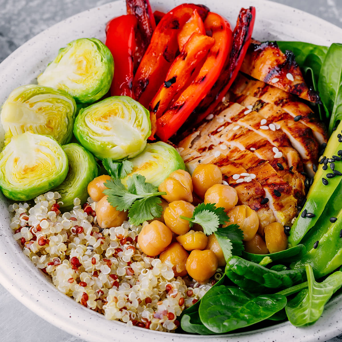 buddha bowl lunch with chicken chickpeas brussels sprouts