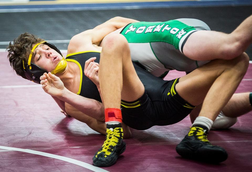 Cowan's Jayden Jett and Yorktown's Justin Boone wrestle in the 126 pound weight class during the Delaware County Wrestling Tournament at Wes-Del High School Thursday, Jan. 6, 2022. 