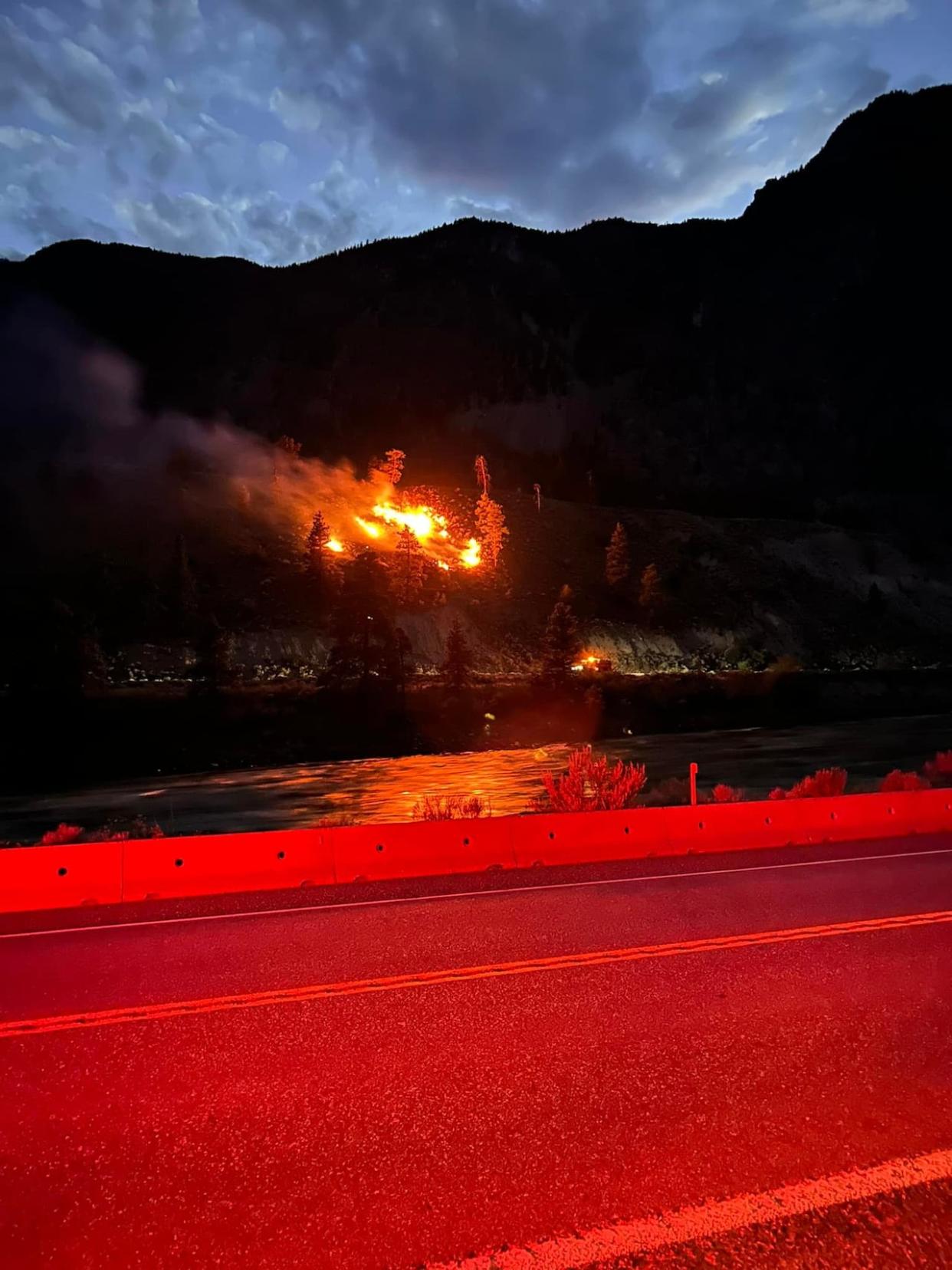 A fire burns along a CN Rail line on July 4, 2024. The Cook's Ferry Indian Band believes the rail company should be held responsible for the fire. (Chief Christine Walkem/Facebook - image credit)