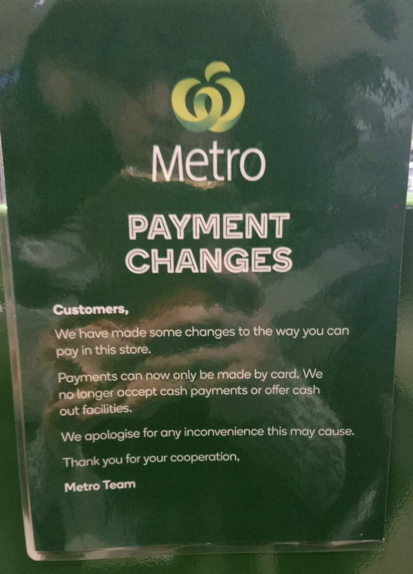 Photo shows sign in Woolworths telling customers cash payments will not be accepted.