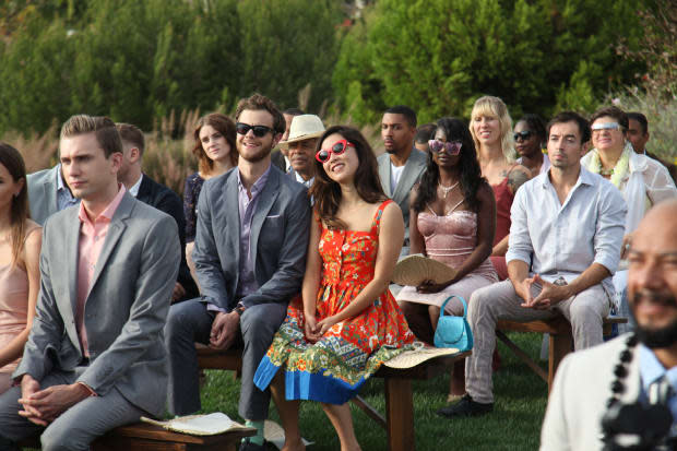 "It felt like a falling in love dress," says Erskine about her printed summer wedding dress. Jack Quaid as Ben and Erskine as Alice in "Plus One" (center). Photo: Courtesy of RLJE Films