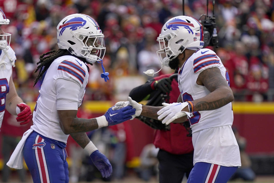 Buffalo Bills running back James Cook is congratulated by teammate Gabe Davis, right, during the first half of an NFL football game Sunday, Dec. 10, 2023, in Kansas City, Mo. (AP Photo/Charlie Riedel)