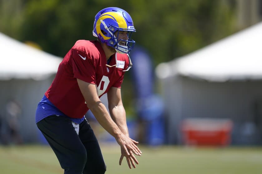 Los Angeles Rams quarterback Matthew Stafford (9) participates in drills at the NFL football team's practice facility in Irvine, Calif. Monday, Aug. 8, 2022. (AP Photo/Ashley Landis)