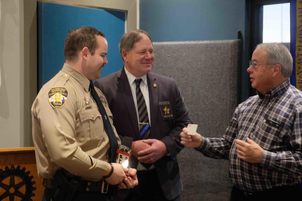 Perry Gilmore with the Amarillo South Rotary Club presents Deputy Matt Mitchell with the Randall County Deputy of the Year Award at a Thursday morning ceremony in Amarillo.