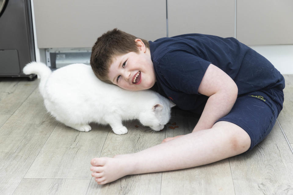 Connor Raven, age 6 and his cat Minty (Fabio De Paola/PA)