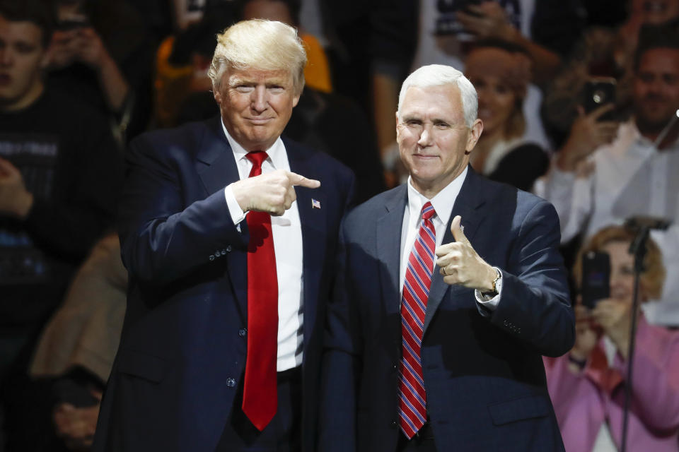 FILE - President-elect Donald Trump, left, and Vice President-elect Mike Pence acknowledge the crowd during the first stop of his post-election tour, in Cincinnati on Dec. 1, 2016. A new CNN Films documentary explores the role of the U.S. vice presidency, which in modern times has emerged into a more powerful position. Still, the film notes that a veep’s duties are all up to the president. (AP Photo/John Minchillo, File)