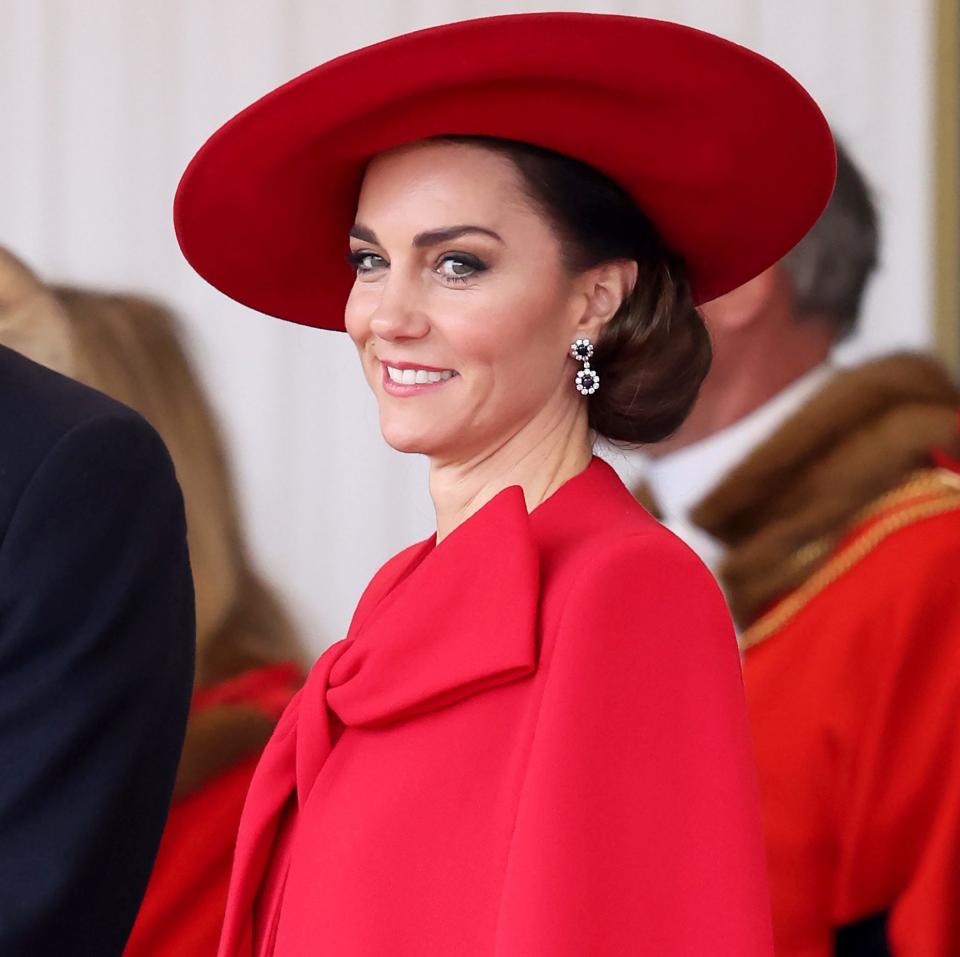 The striking red cape the princess wore to greet the South Korean President was an addition to her existing outfit by Catherine Walker & Co.