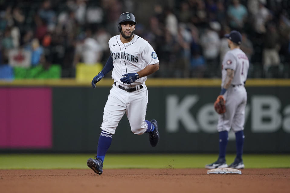 Seattle Mariners' Abraham Toro rounds the bases after hitting a two-run home run against the Houston Astros during the ninth inning of a baseball game, Tuesday, July 27, 2021, in Seattle. Toro was traded to the Mariners from the Astros earlier in the day. The Astros won 8-6. (AP Photo/Ted S. Warren)
