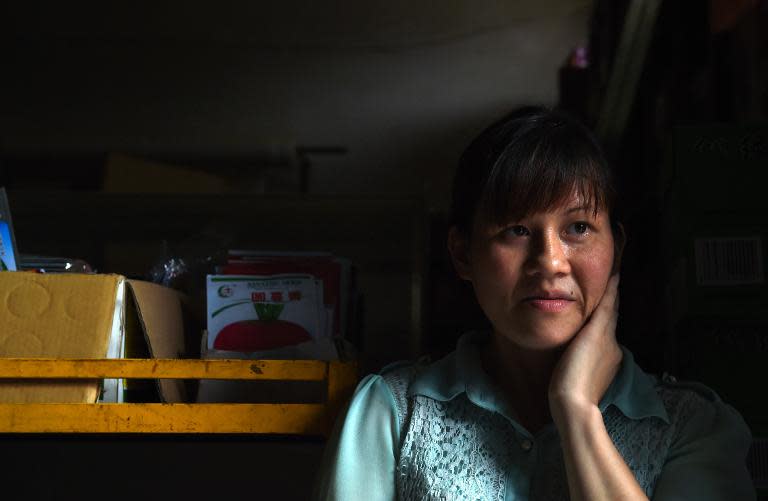 Vietnamese bride Nguyen Thi Hang pictured in the shop where she works in Weijian village, China's Henan province on July 29, 2014