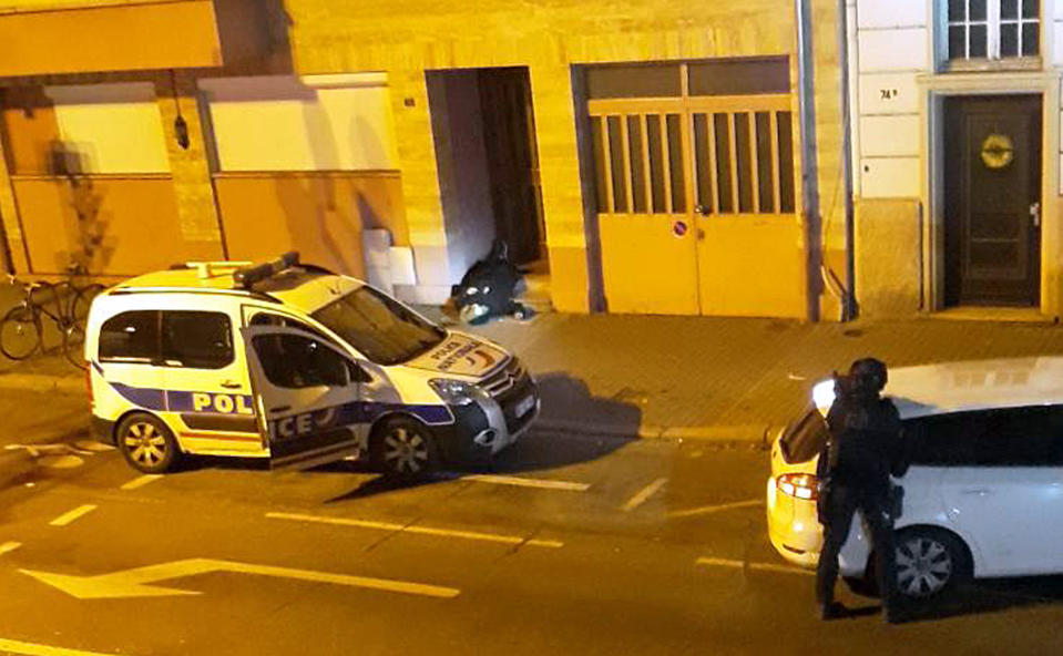 A French police officer looks at the dead body of a man lying in the doorway of a building after a shootout with police in Strasbourg, eastern France, Thursday, Dec. 13, 2018. The dead man was suspected of being the gunman who killed three people near a Christmas market in Strasbourg. Interior Minister Christophe Castaner said the dead man’s identity hasn’t been confirmed yet. But Castaner said the “individual corresponds to the description of the person sought since Tuesday night,” 29-year-old Cherif Chekatt. (Photo: AP)