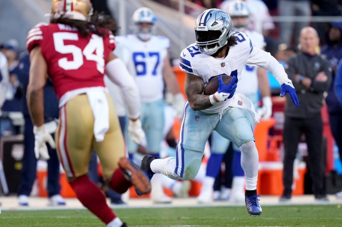 Dallas Cowboys running back Ezekiel Elliott (21) stands on stands against  the Denver Broncos in the first half of an NFL football game Saturday, Aug  13, 2022, in Denver. (AP Photo/Bart Young