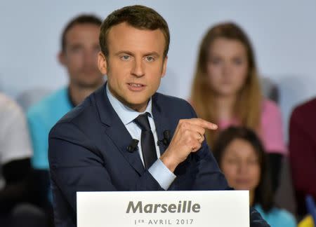 Emmanuel Macron, head of the political movement En Marche !, or Onwards !, and candidate for the 2017 French presidential election, attends a campaign rally in Marseille, France, April 1, 2017. REUTERS/Philippe Laurenson