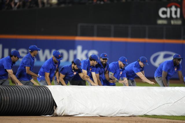 Canha's sacrifice fly after rain delay lifts Mets to 2-1 win over