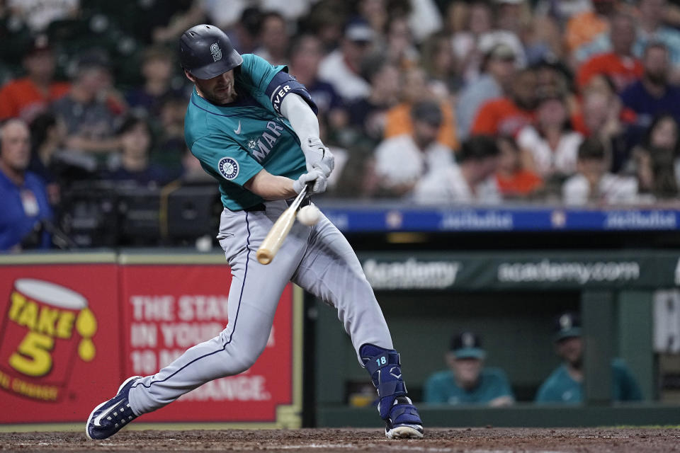 Seattle Mariners designated hitter Mitch Garver hits an RBI double during the fourth inning of a baseball game against the Houston Astros Saturday, May 4, 2024, in Houston. (AP Photo/Kevin M. Cox)