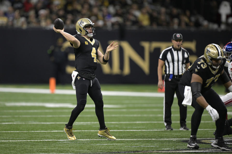 New Orleans Saints quarterback Derek Carr throws during the first half of an NFL football game against the New York Giants Sunday, Dec. 17, 2023, in New Orleans. (AP Photo/Matthew Hinton)