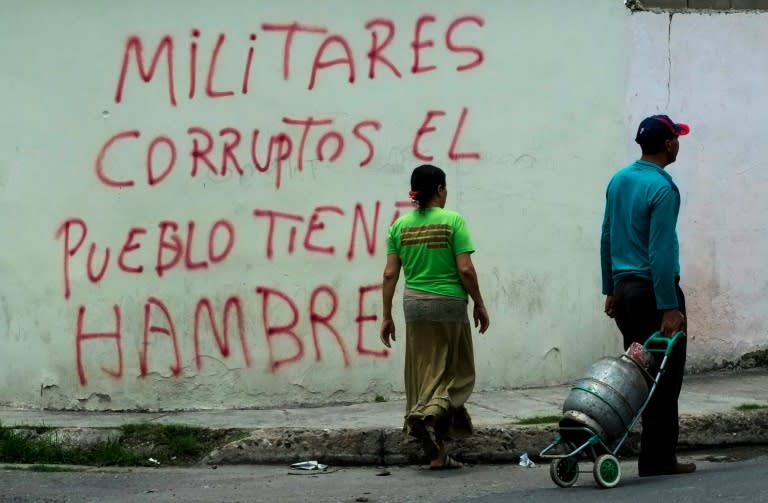 Graffiti in the low income Santa Rita neighborhood in Maracay, 70km from Caracas, reads "Corrupt military, the people are hungry"