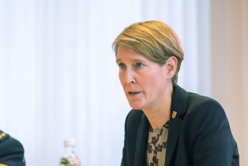 Stefanie Hinz, state police chief of Baden-Wuerttemberg, sits and speaks during a press conference at the Offenburg police headquarters. The attacks on merchant ships in the Red Sea are severely impacting global maritime container traffic, with volumes in the area down by nearly 70% of anticipated cargo, a leading German economic institute reported on Thursday. Philipp von Ditfurth/dpa