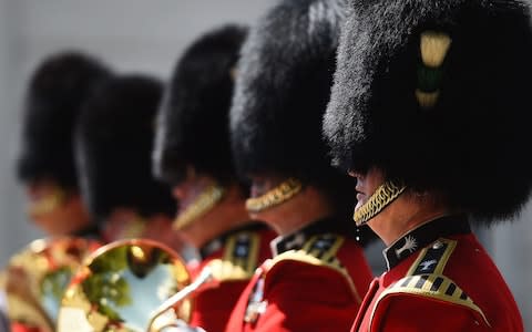 A bead of sweat falls from a member of The Queen's Guard as he takes part in the Changing the Guard ceremony at Wellington Barracks in London - Credit: Kirsty O'Connor /PA