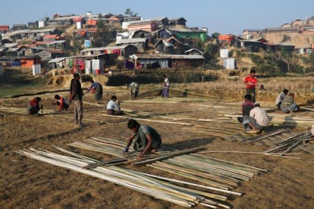 Rohingya refugees build shelter with bamboo at the Jamtoli camp in the morning in Cox's Bazar, Bangladesh, January 22, 2018. REUTERS/Mohammad Ponir Hossain